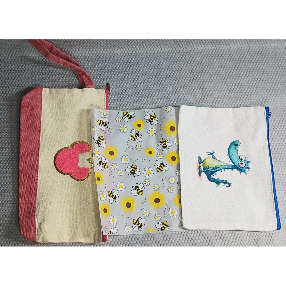 3 make-up bags ( 1- canvas w/strap and mickey head, 1 clear w/ bees & 1 canvas)